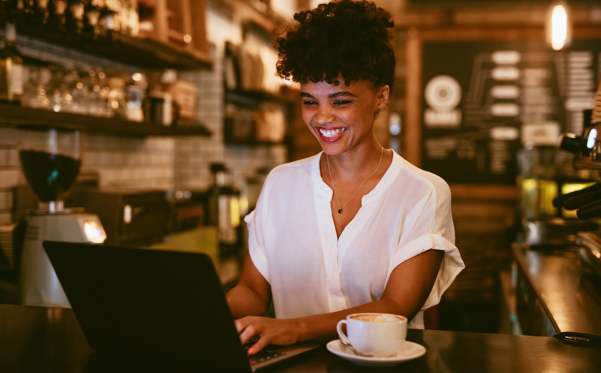 Woman at laptop typing