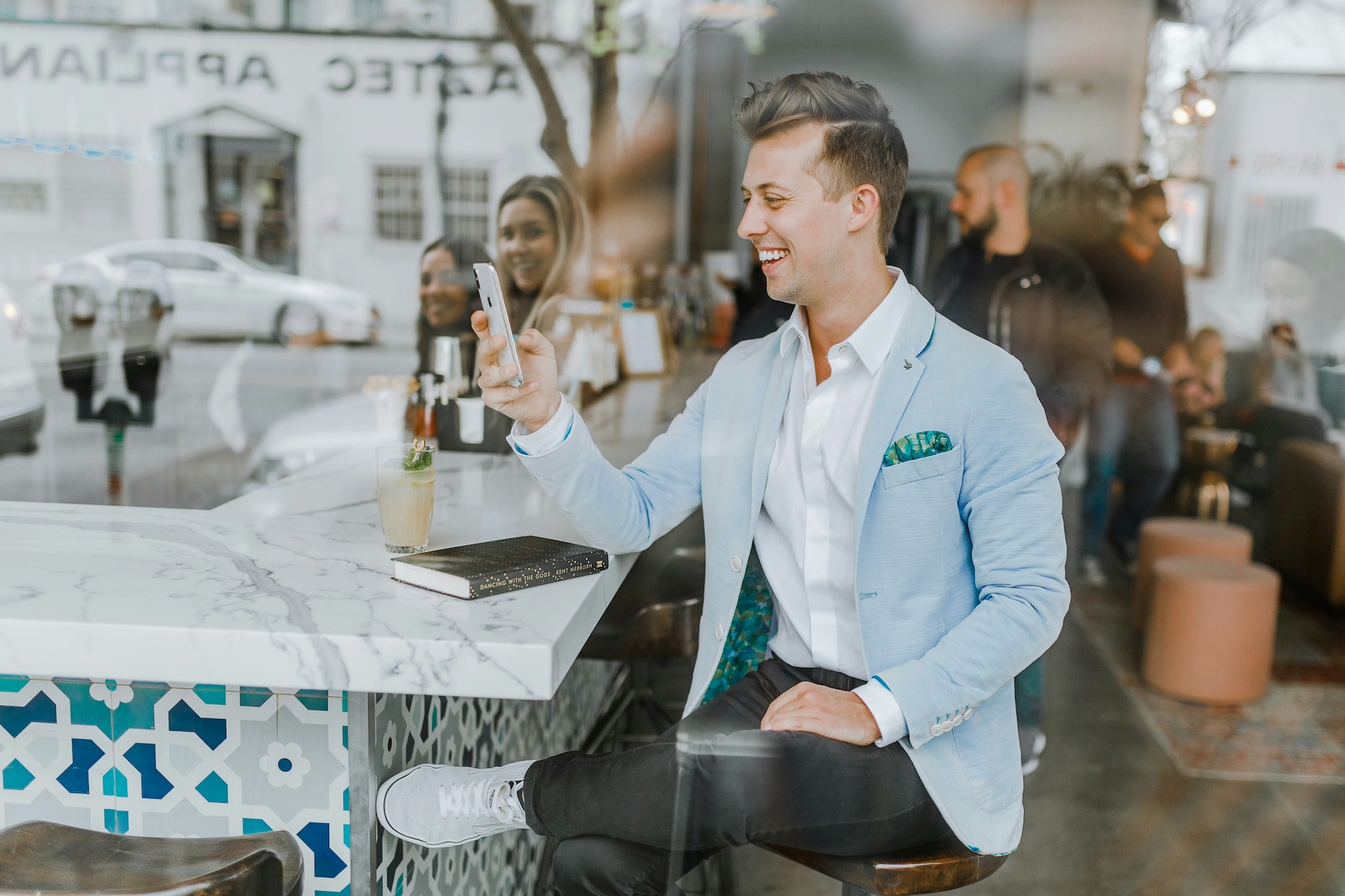 Restaurant manager smiles at phone