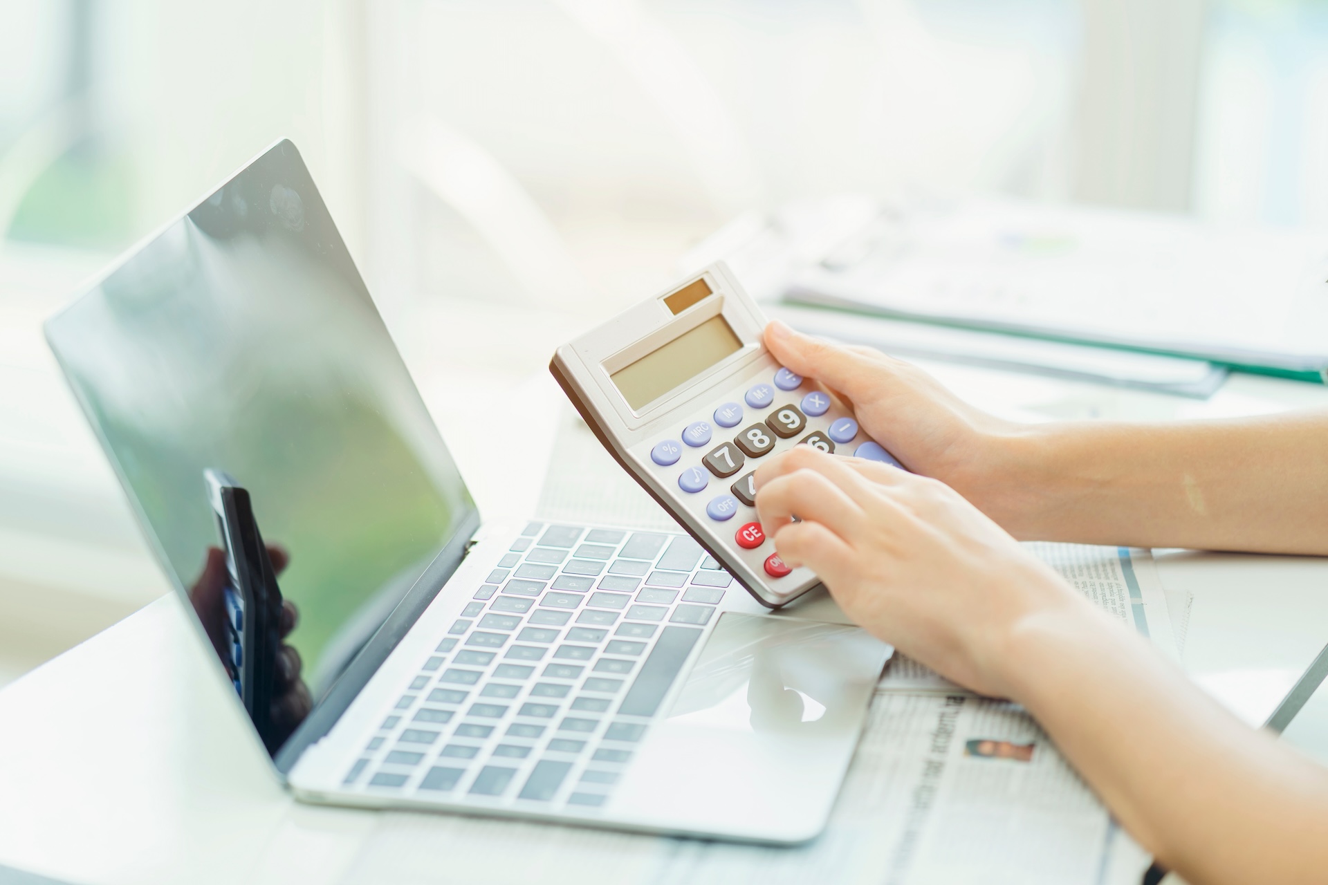 Using calculator and computer laptop for calculations