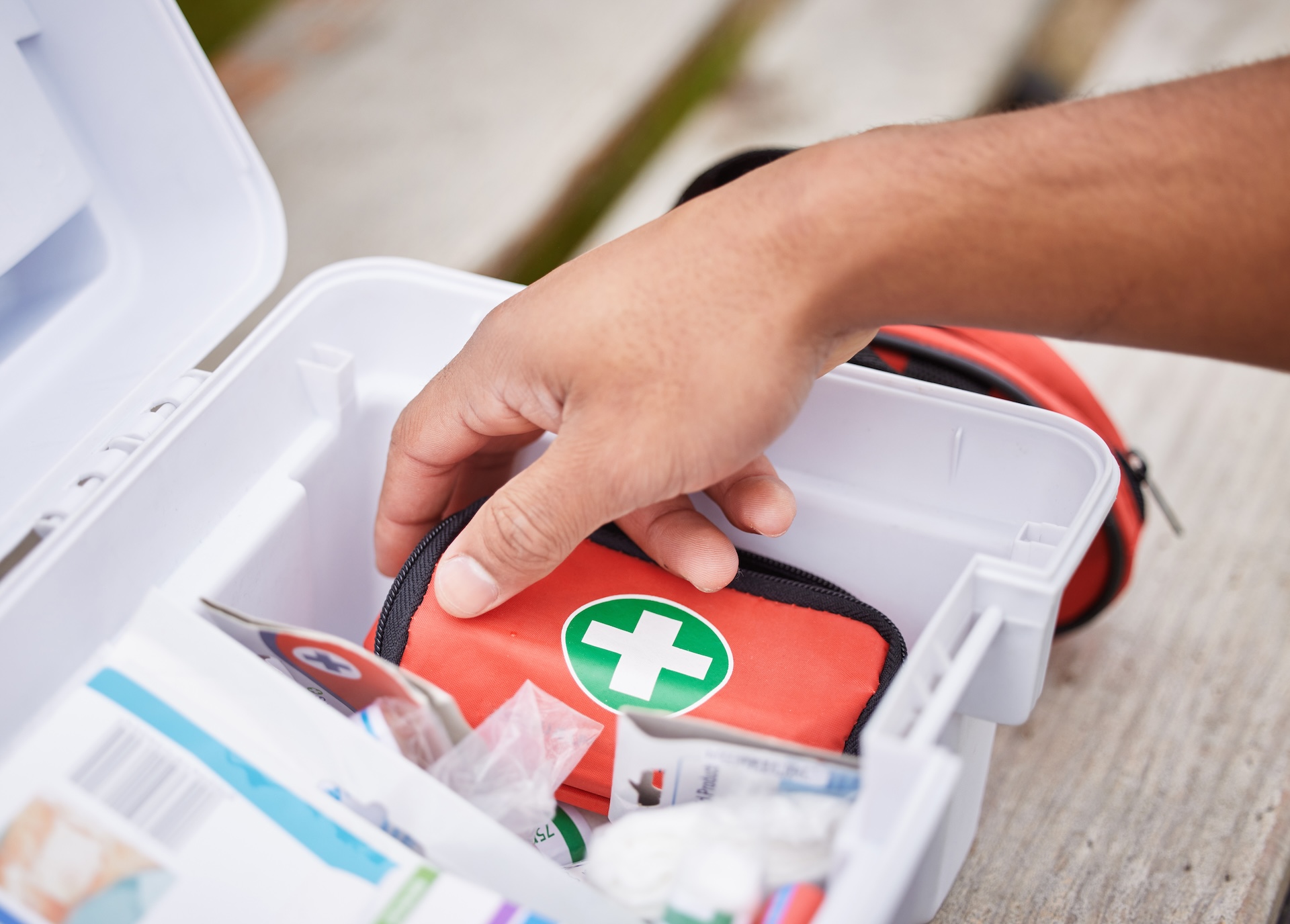 Paramedic looking in his first aid kit