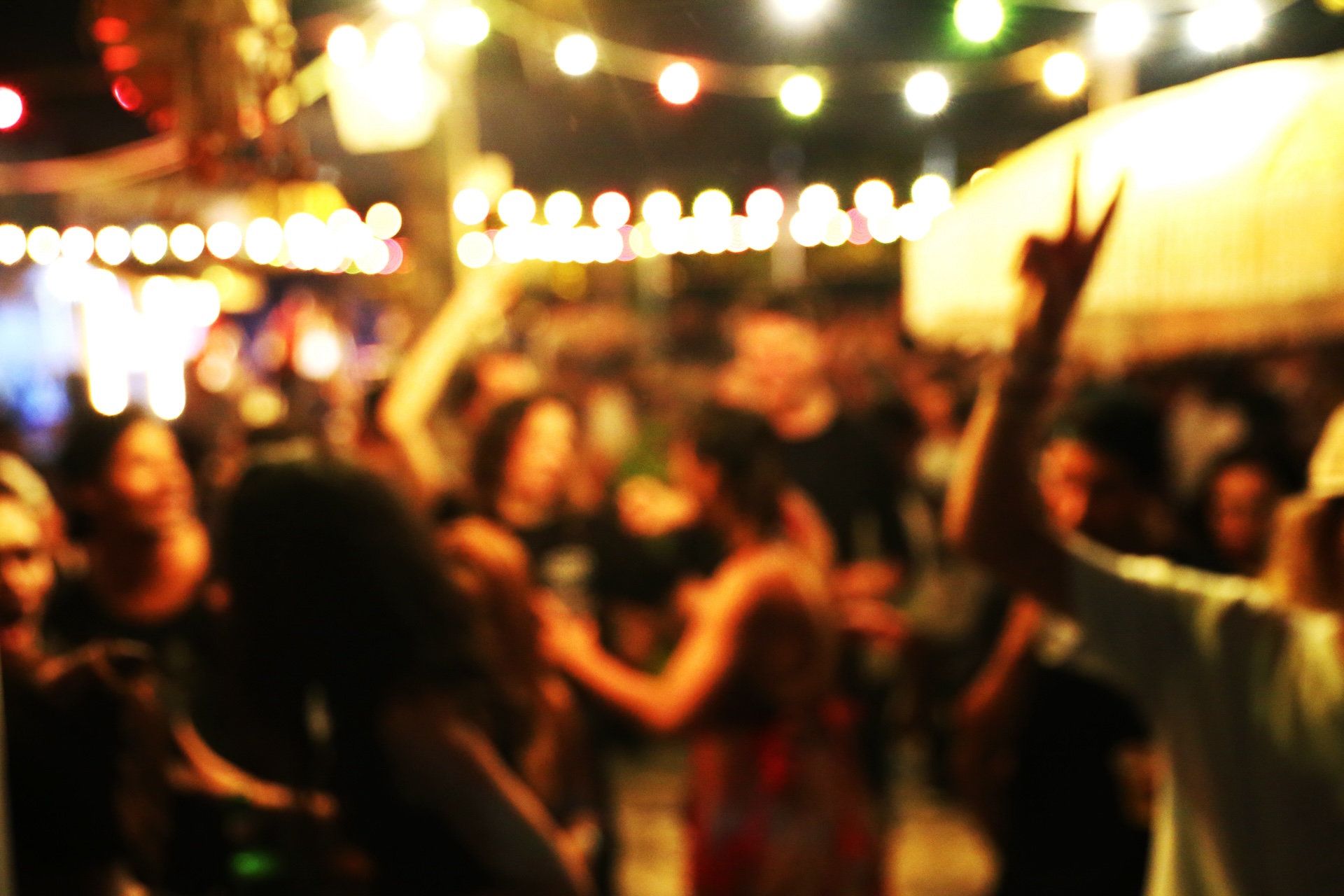 Blurred background of many people had fun at a beach party