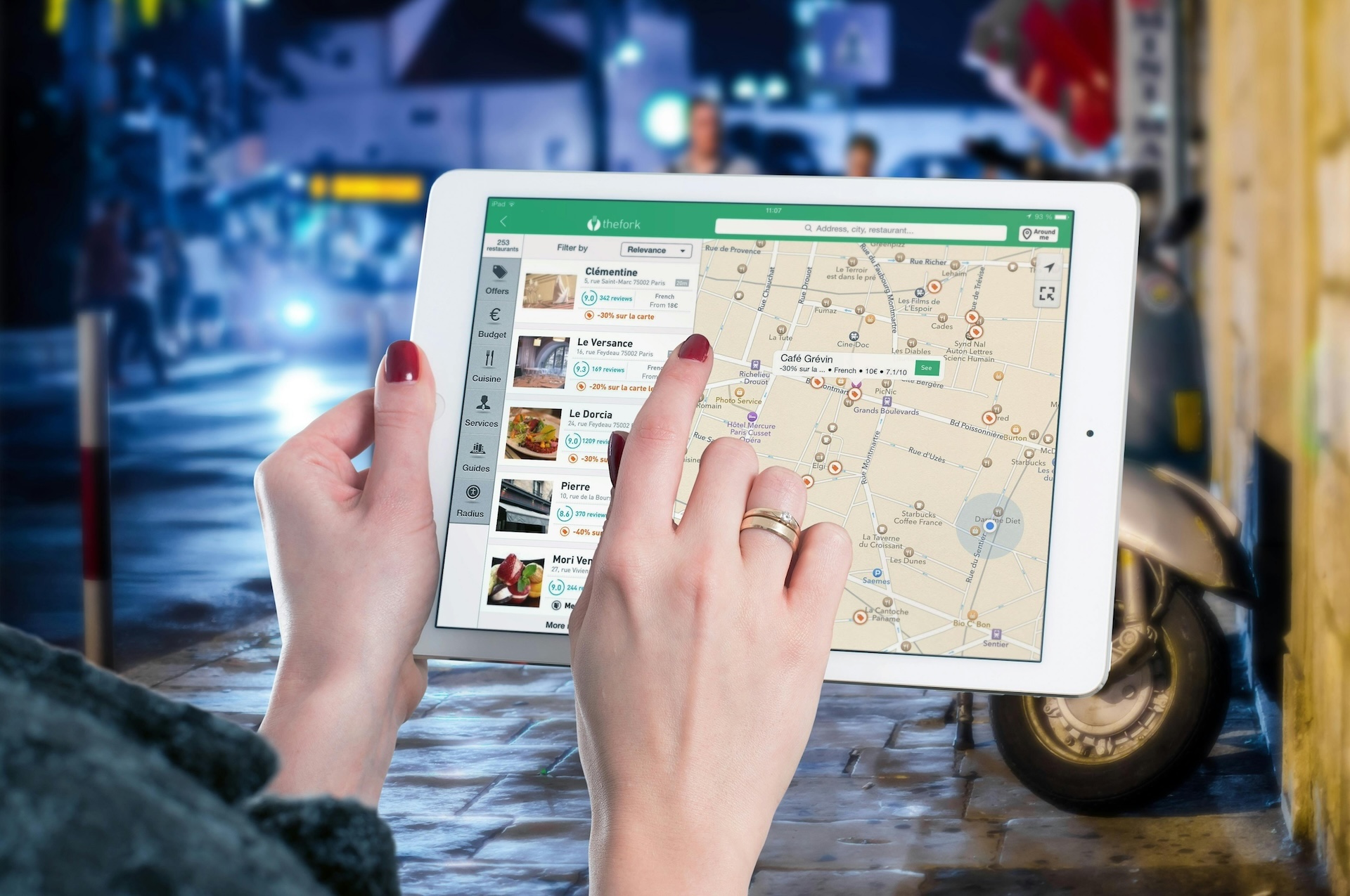 white ipad showing Google map and marketing restaurants in the area