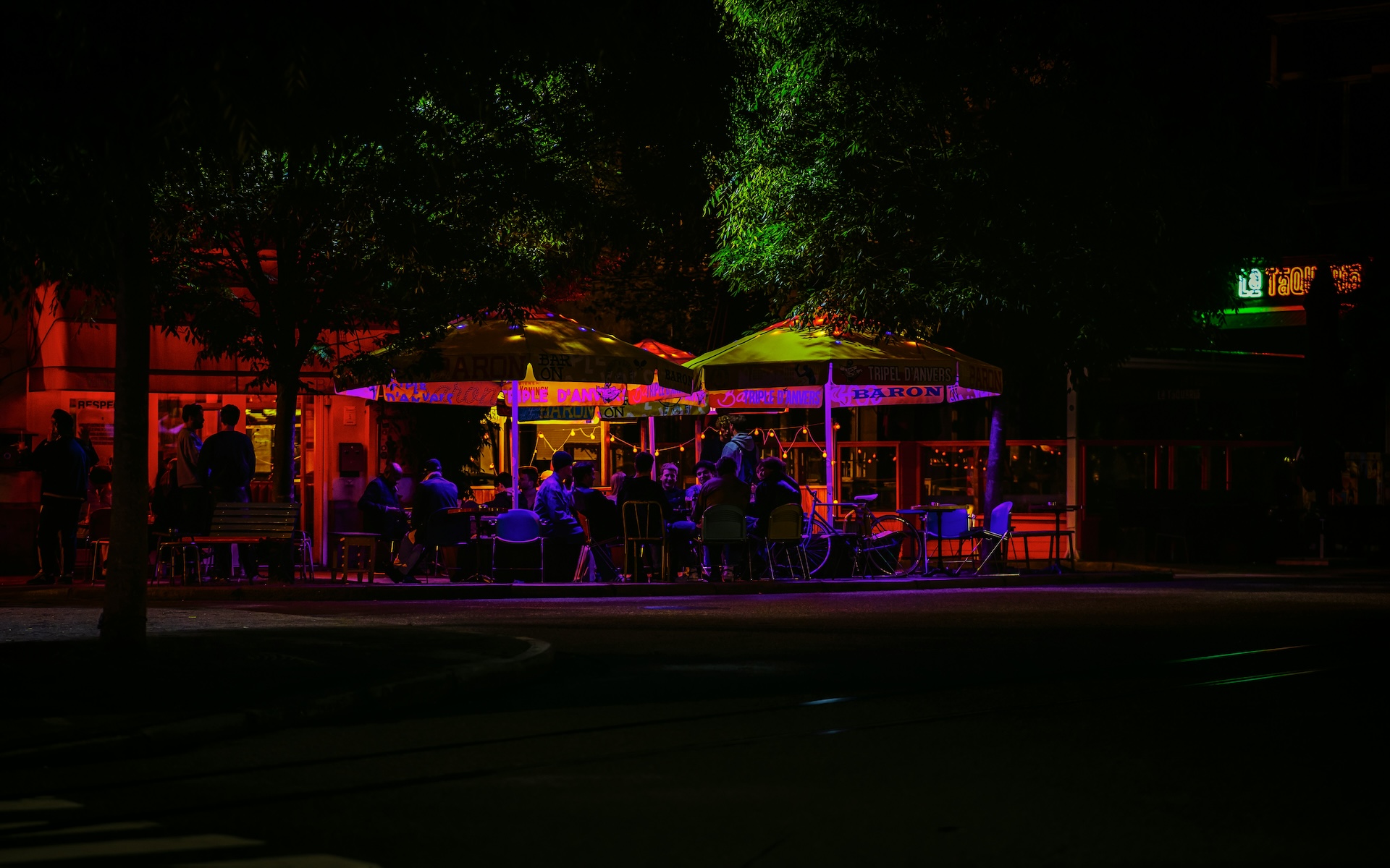 Multicolored fairy lights outside a bar