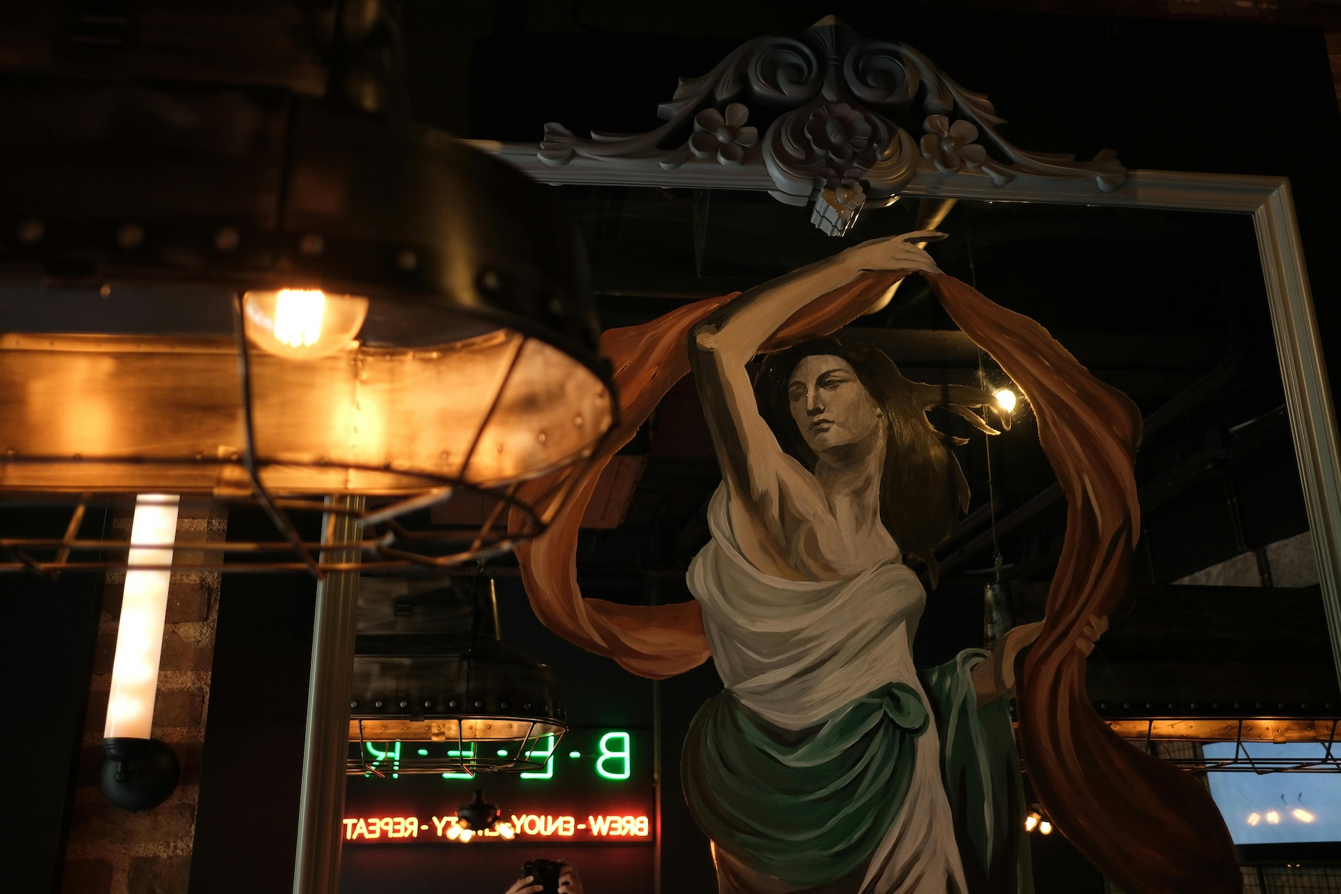 renaissance painting as bar decor reflected in a mirror