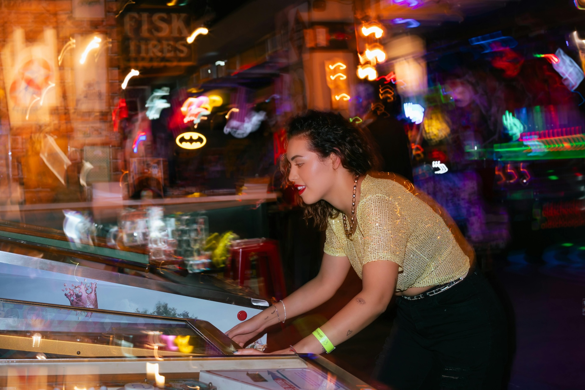 woman playing arcade bar games