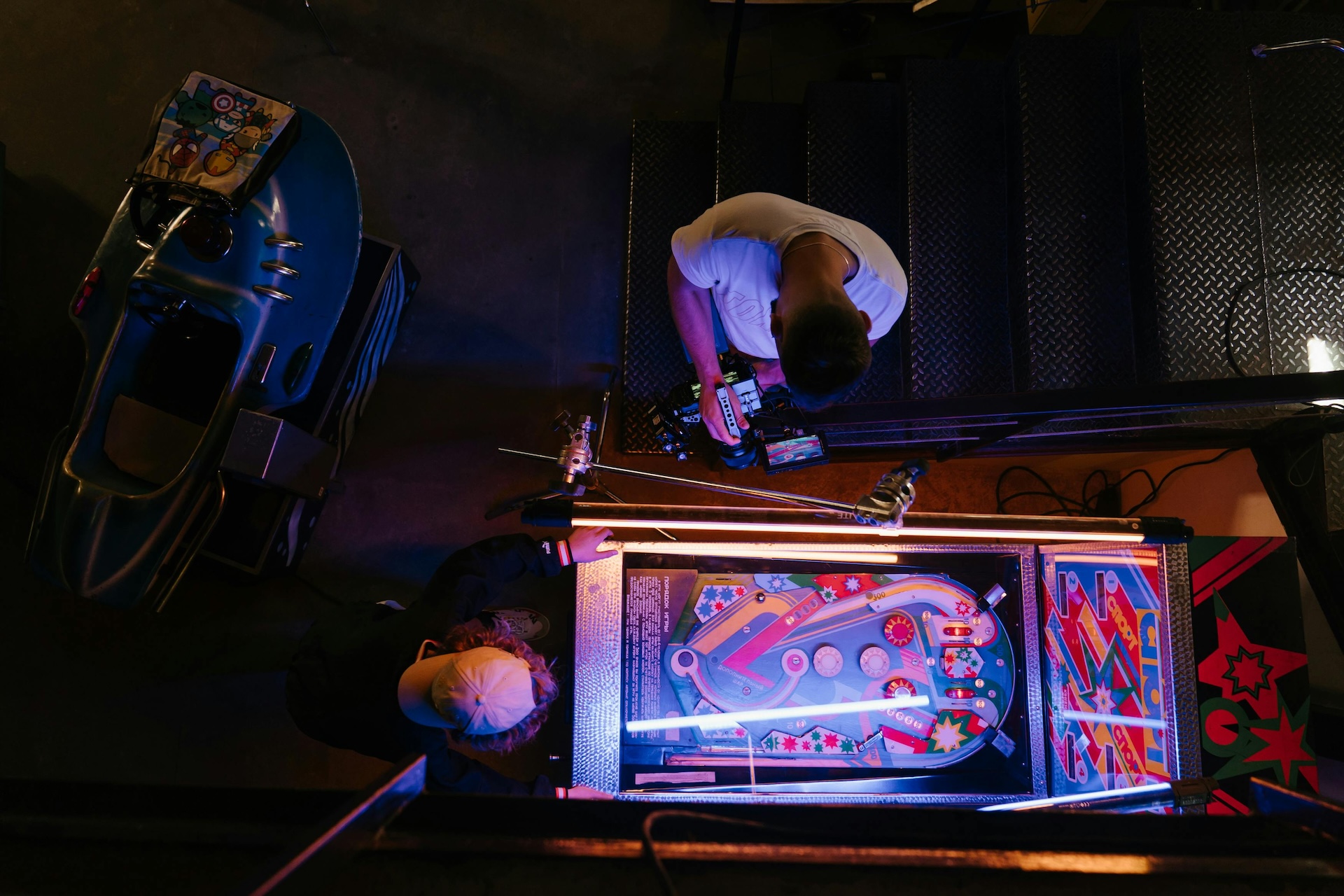 man playing pinball bar game