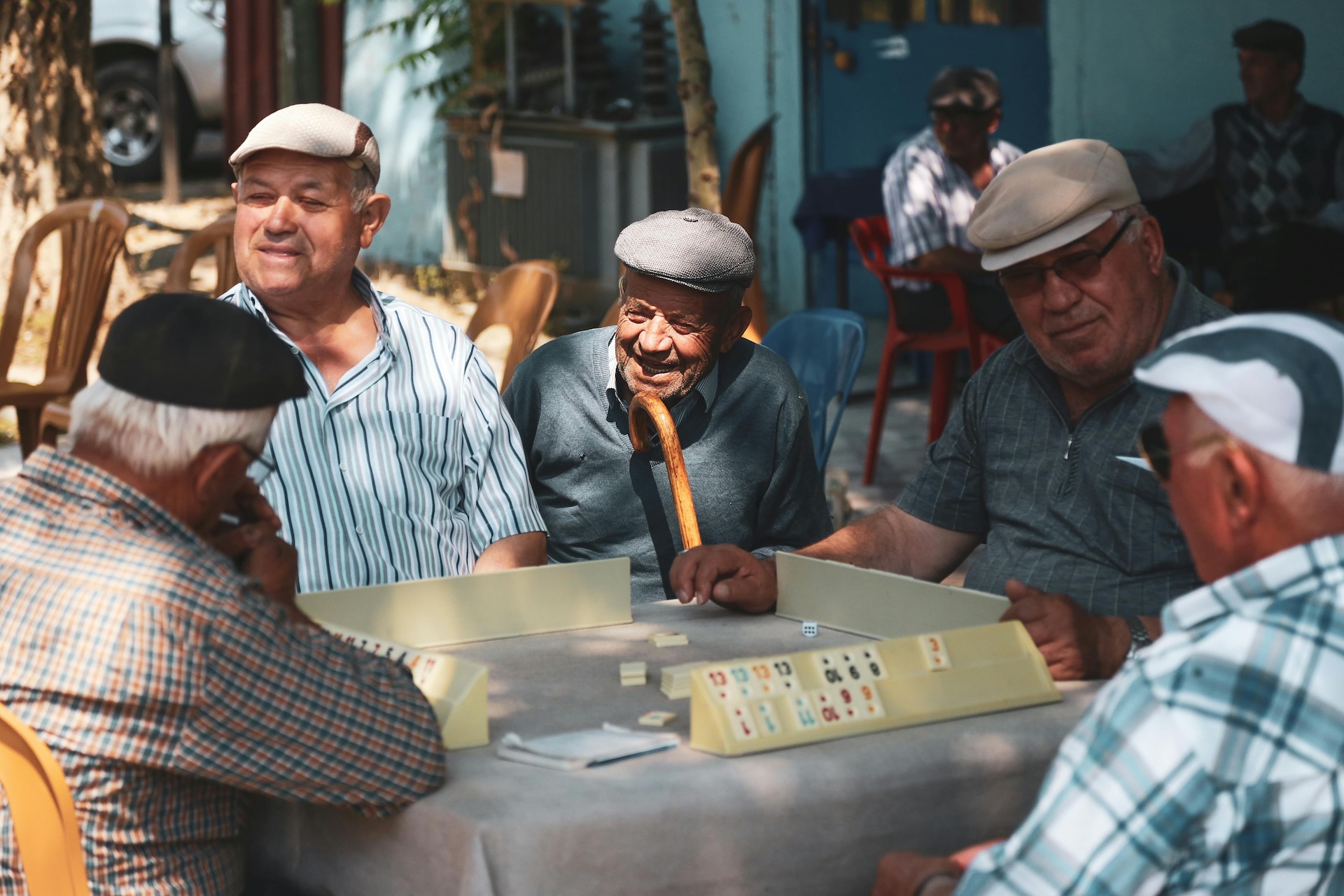 group of old men playing bar games