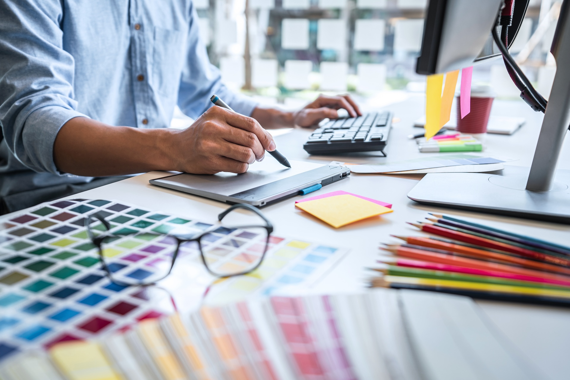 creative graphic designer working on color selection for restaurant marketing agency