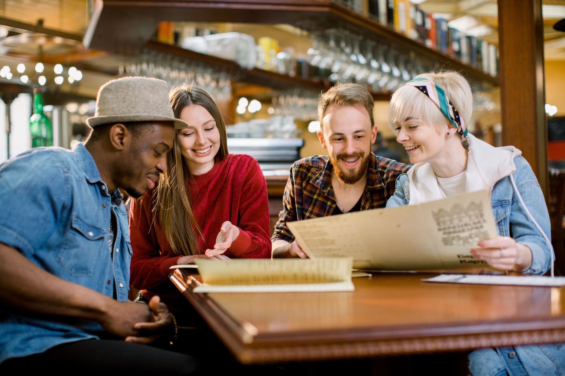 friends consider a restaurant menu