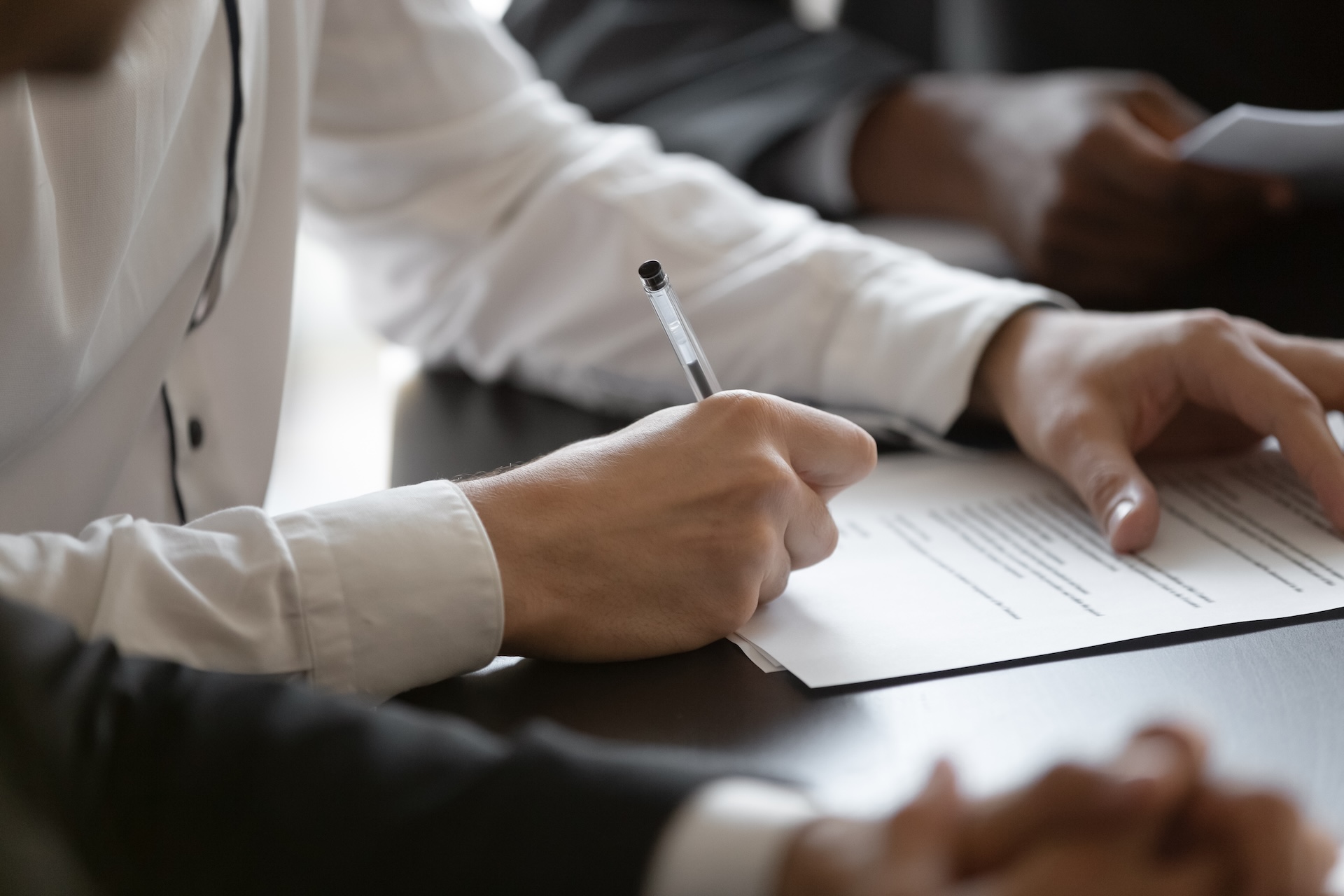 wine bar owner signing liquor license