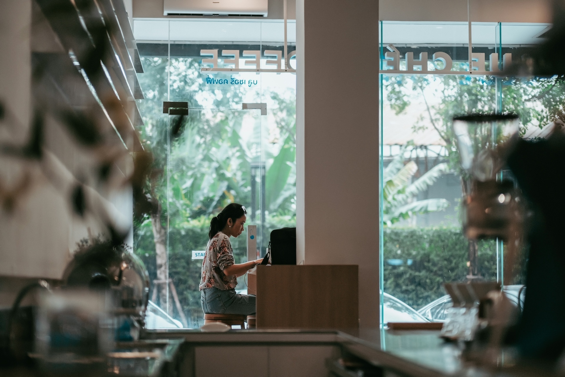 woman sitting working on the functions of financial management in restaurant