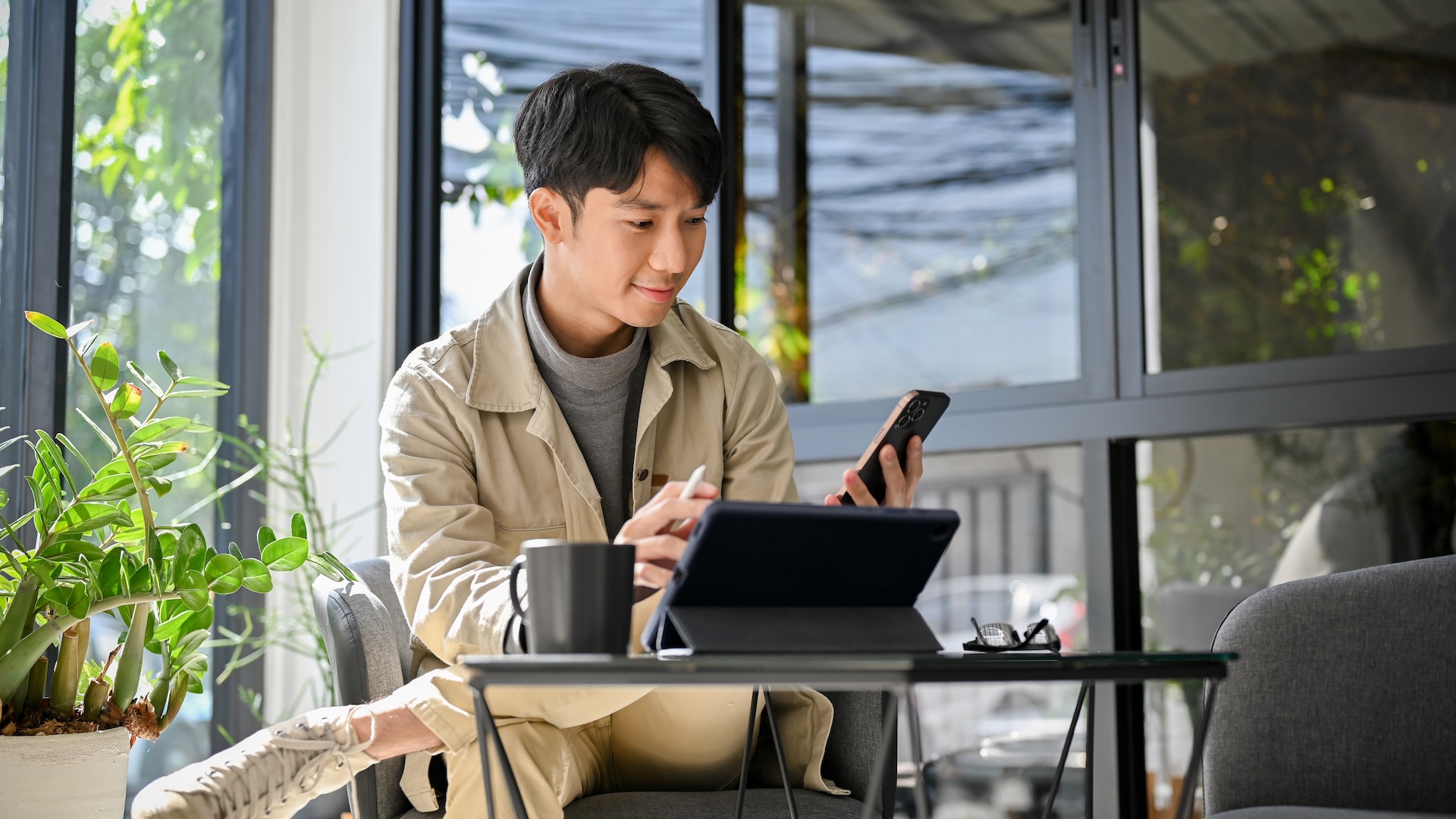 man using event management services at a coffee shop
