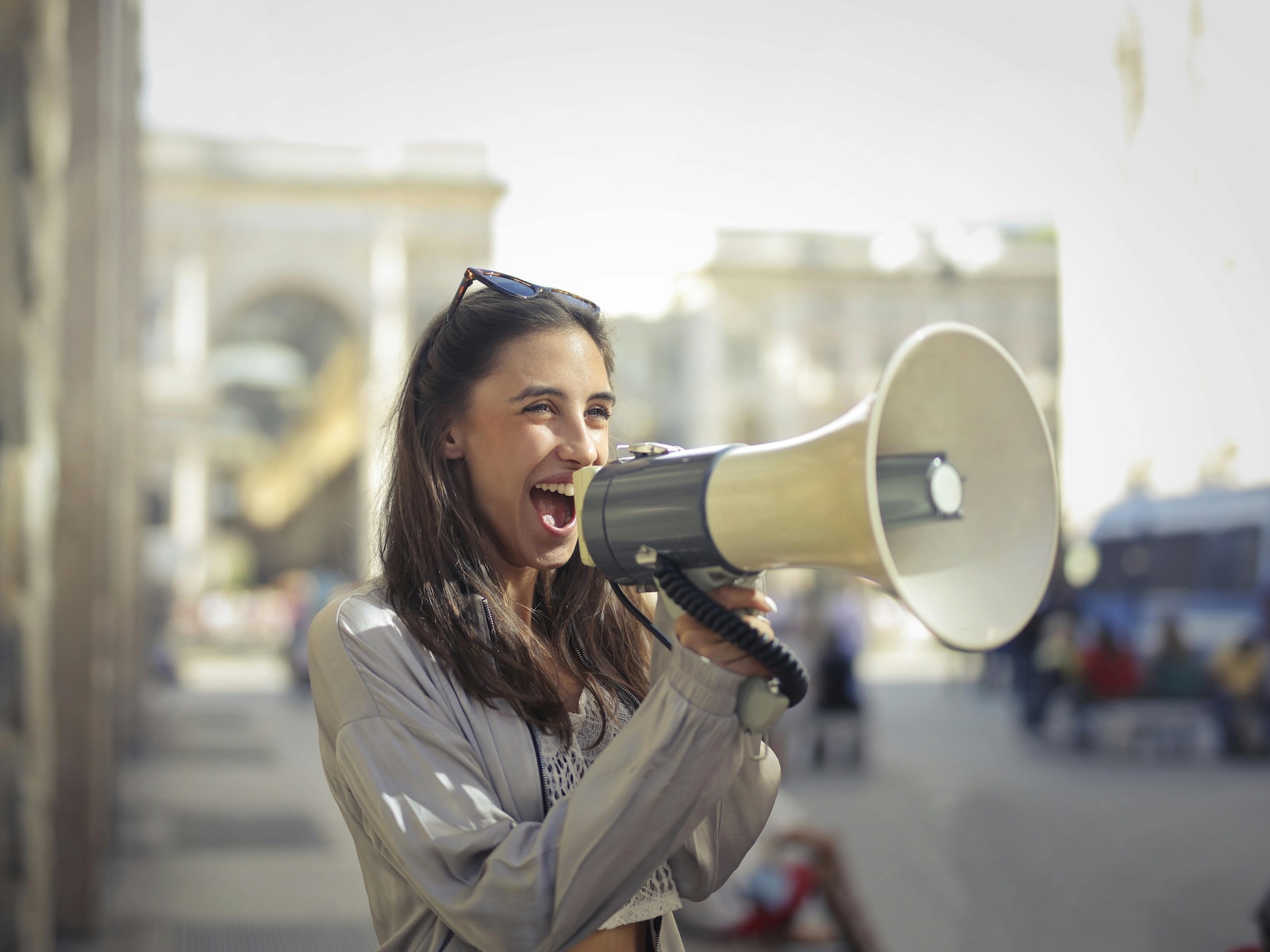 woman shouting into loudspeaker
