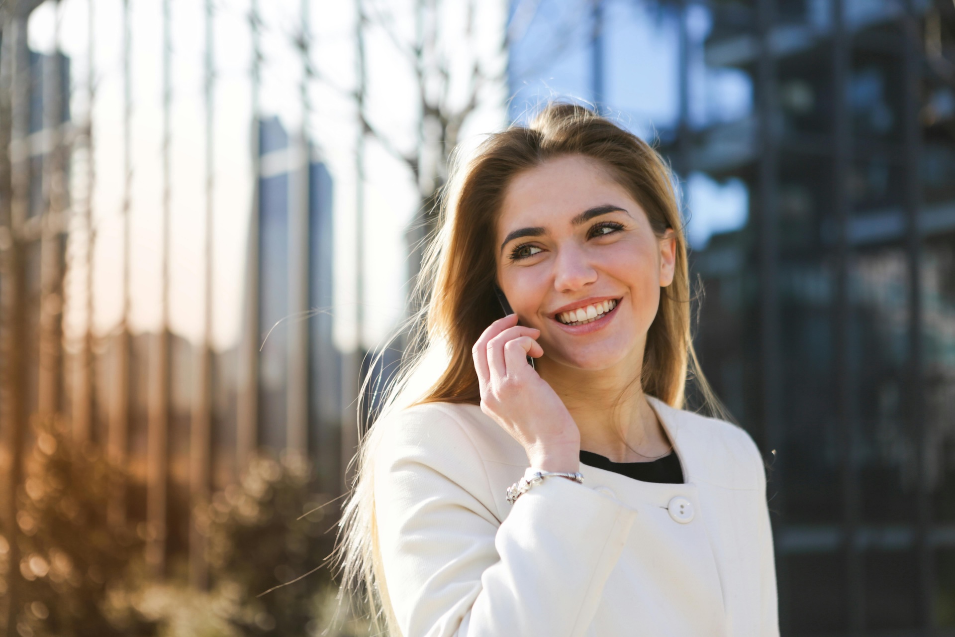 smiling professional women on a phone call