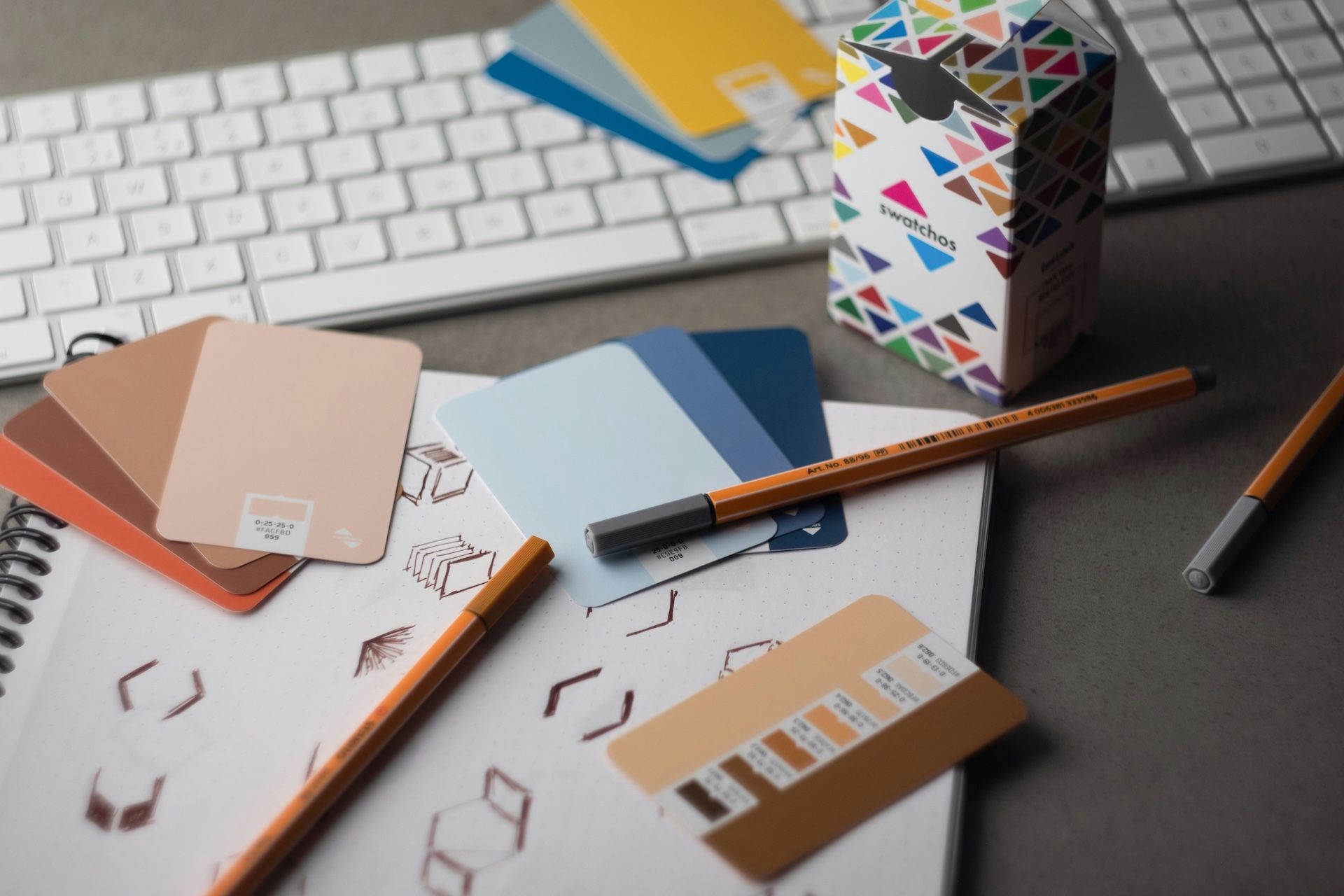 desk of event coordinator with colour samples and designs