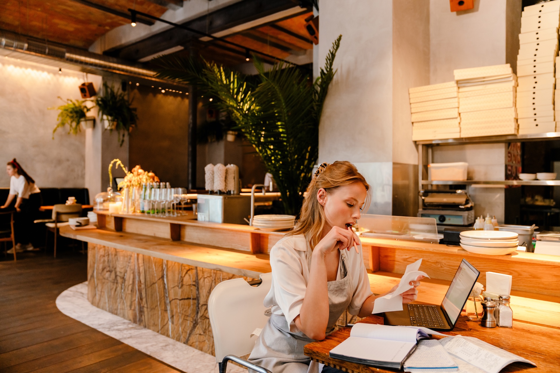 restaurant manager working on invoices