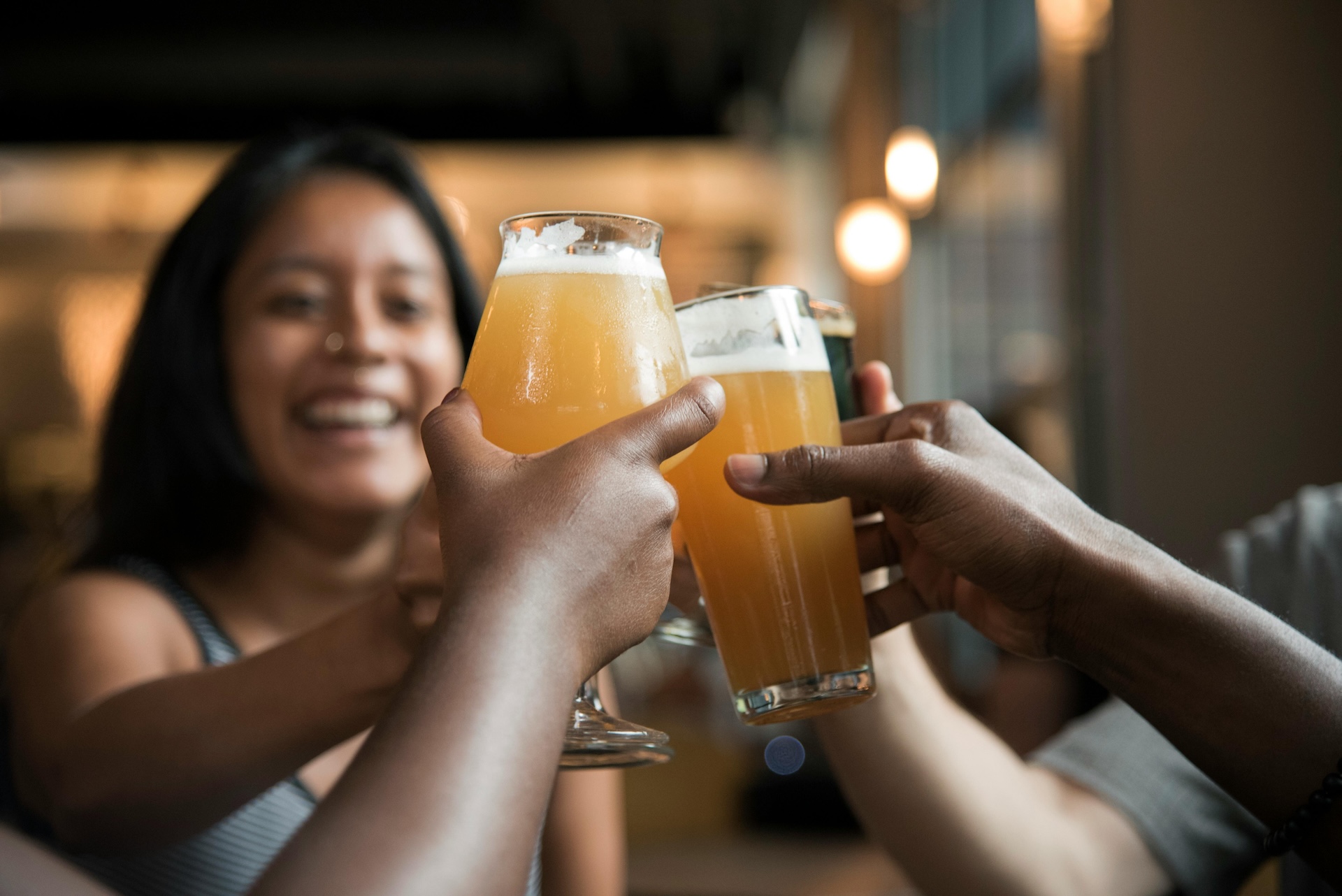 people toasting with beer
