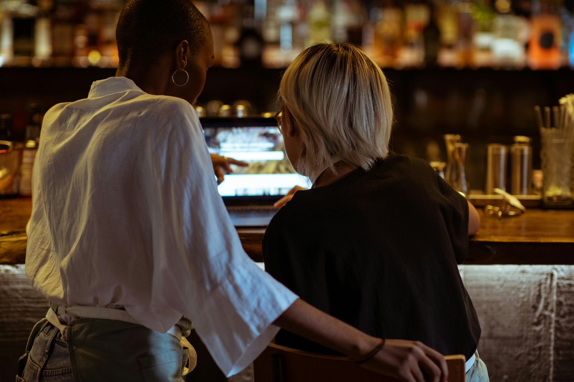 bar staff working together on menu