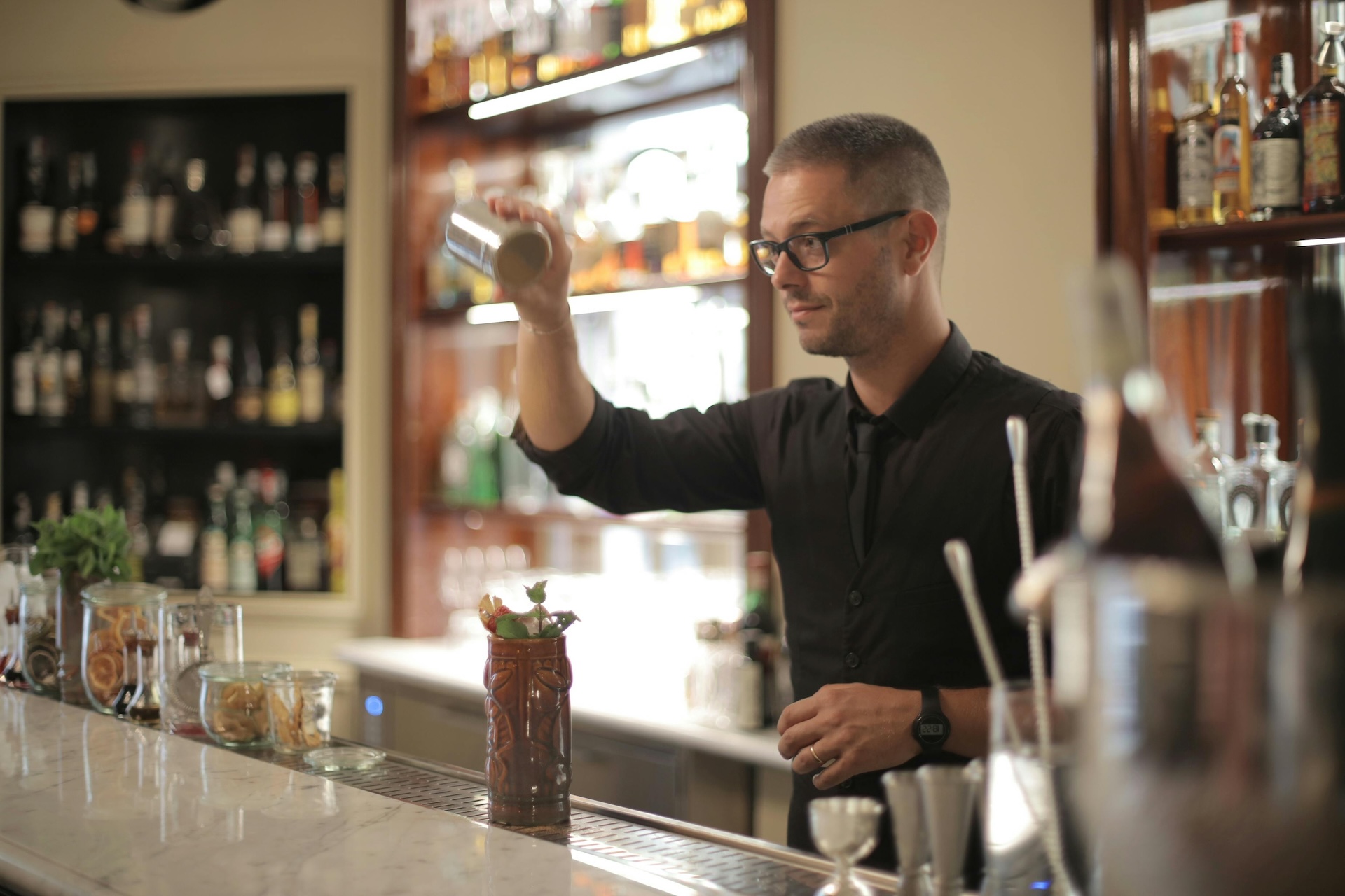 bartender making signature cocktail